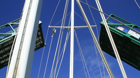 Sailboat under a drawbridge